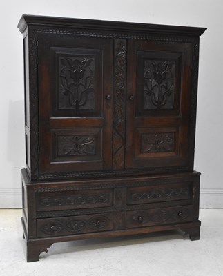 Lot 1082 - An 18th century and later carved oak livery...