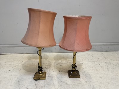 Lot 1307 - A pair of brass fluted column lamps, with...