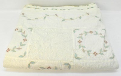 Lot 403 - A vintage handsewn patchwork quilt, with...