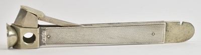 Lot 1160 - A vintage silver clad cigar cutter, with two...
