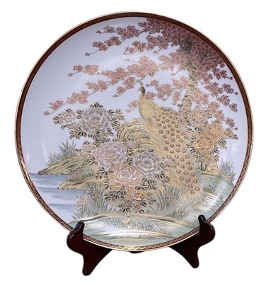 Lot 1052 - A Japanese Satsuma shallow dish, painted with...