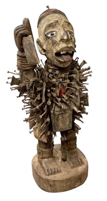 Lot 1077 - An African carved wooden Nkisi nail fetish...