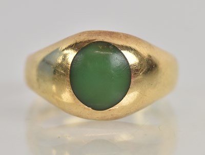Lot 1234 - An 18ct yellow gold green stone set signet...