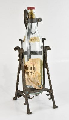 Lot 1417 - A wrought iron swinging bottle pourer, with...