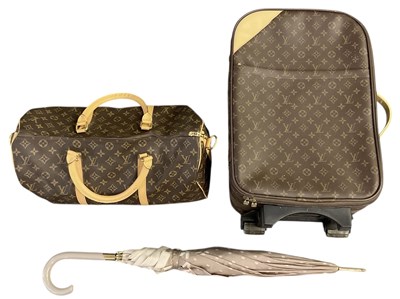 Lot 408 - IN THE STYLE OF LOUIS VUITTON; a brown leather...