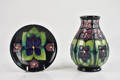 Lot 244 - MOORCROFT; a 'Violet', pattern pin dish and...