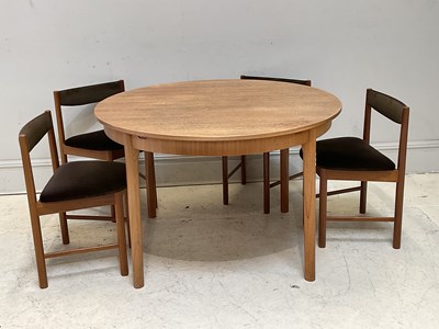 Lot 1085 - A mid century teak extending circular table,...