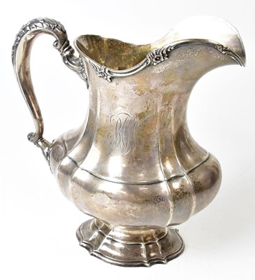 Lot 609 - A sterling silver jug of shaped and lobed form,...