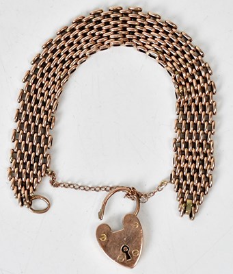 Lot 697 - A 9ct rose gold gate link bracelet with...