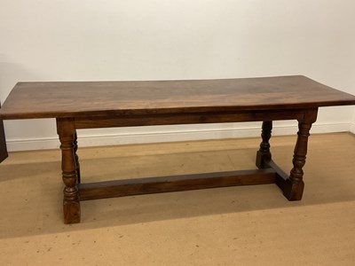 Lot 458 - An oak refectory table with turned legs and...