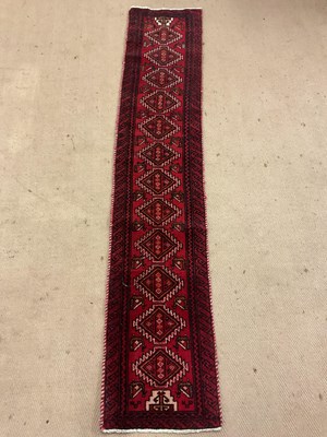 Lot 443 - An Afghan Baluch runner rug, 217 x 42cm.