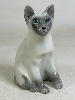 Lot 147 - WINSTANLEY POTTERY; a model of a seated cat,...