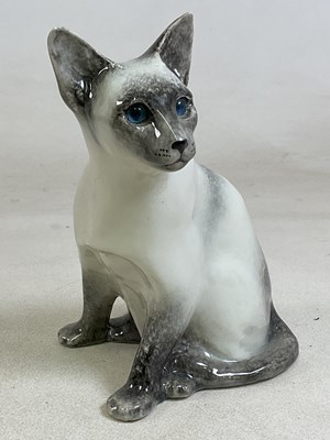 Lot 148 - WINSTANLEY POTTERY; a model of a seated cat,...
