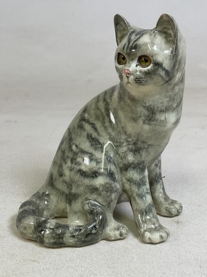 Lot 151 - WINSTANLEY POTTERY; a model of a seated cat,...