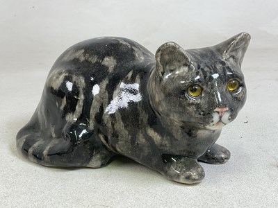 Lot 152 - WINSTANLEY POTTERY; a model of a recumbent cat,...