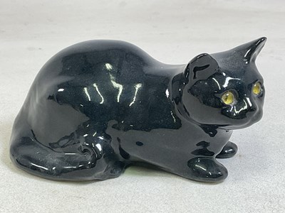 Lot 153 - WINSTANLEY POTTERY; a model of a recumbent cat,...