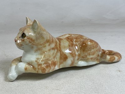 Lot 154 - WINSTANLEY POTTERY; a model of a recumbent cat,...