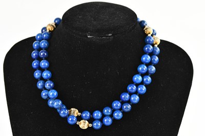 Lot 432 - A lapis lazuli beaded necklace interspersed...