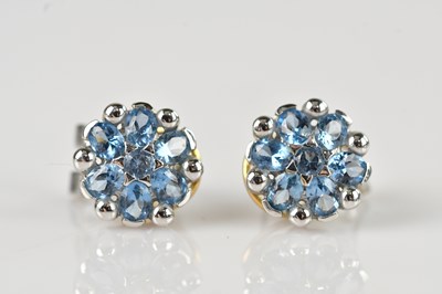 Lot 257 - A pair of yellow and white metal ear clips set...