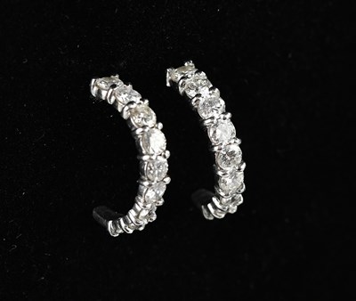 Lot 233 - A pair of 18ct white gold diamond set nine...