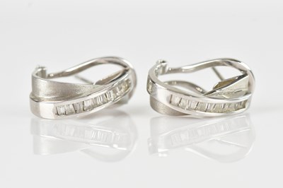 Lot 249 - A pair of white metal ear studs, stamped '750',...