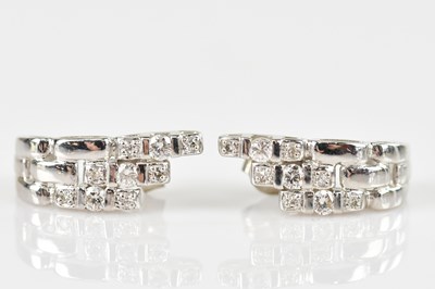 Lot 250 - A pair of 18ct white gold diamond set ear...