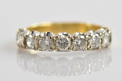 Lot 496 - An 18ct yellow gold seven stone diamond half...