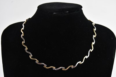 Lot 333 - A 9ct yellow and white gold articulated...