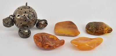 Lot 1458 - Four loose rough cut amber pieces, the largest...