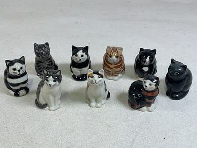 Lot 167 - QUAIL POTTERY; seven seated models of cats,...