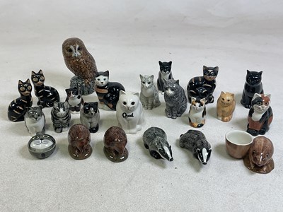 Lot 172 - QUAIL POTTERY; a collection of seated cats,...