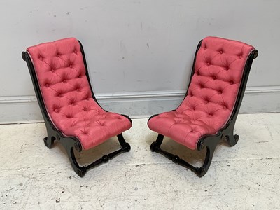 Lot 1127 - A pair of Victorian ebonised slipper chairs,...