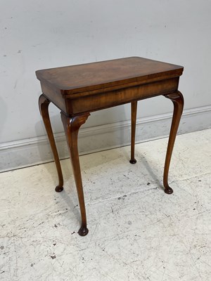 Lot 1147 - An early 20th century walnut games table,...