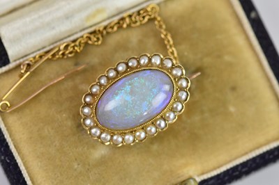 Lot 166 - A Victorian yellow metal oval brooch, set with...