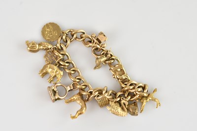 Lot 74 - A 9ct yellow gold flat link bracelet, set with...