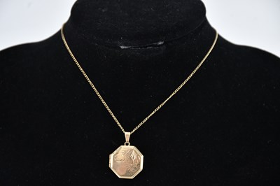 Lot 427 - A 9ct yellow gold octagonal locket, on a 9ct...
