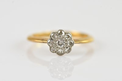 Lot 661 - A yellow metal diamond daisy cluster ring,...