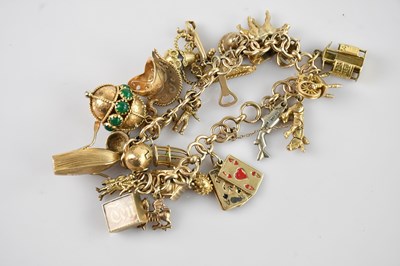 Lot 62 - A 9ct yellow gold heavy gauge charm bracelet...