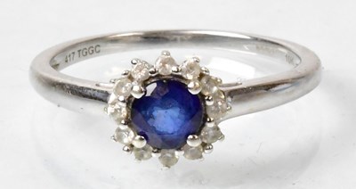 Lot 664 - A 9ct white gold ring set with a central...