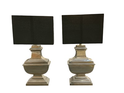 Lot 102 - A pair of modern contemporary silvered table...