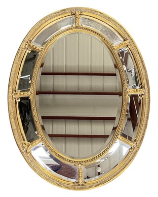 Lot 51 - A large modern reproduction oval gilt framed...