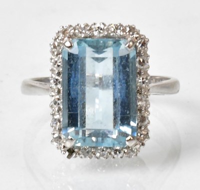 Lot 694 - A platinum ring set with a pale blue stone in...
