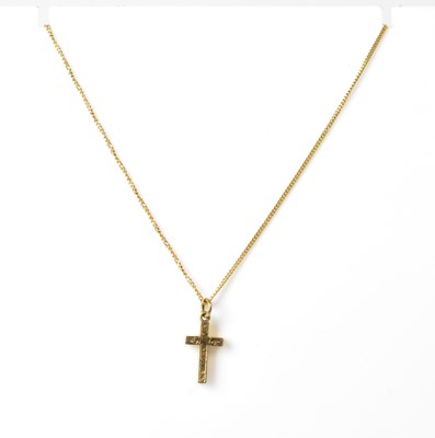Lot 717 - A 9ct yellow gold cross pendant with foliate...