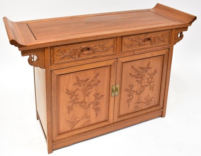 Lot 38 - A modern Chinese hardwood sideboard, with two...
