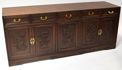 Lot 32 - A modern Chinese dark wood long cabinet, with...