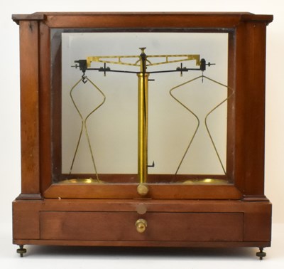 Lot 361 - A set of brass pan scales, in mahogany case...