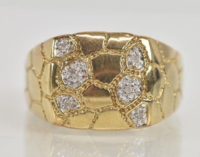 Lot 1243 - A 9ct white gold diamond encrusted football...