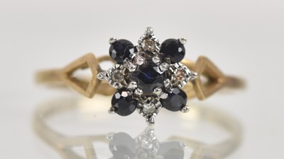 Lot 1301 - A 9ct yellow gold dainty sapphire and diamond...