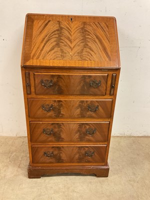 Lot 785 - A small reproduction bureau with four drawers,...