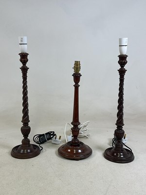 Lot 434 - A pair of mahogany barley twist table lamps,...